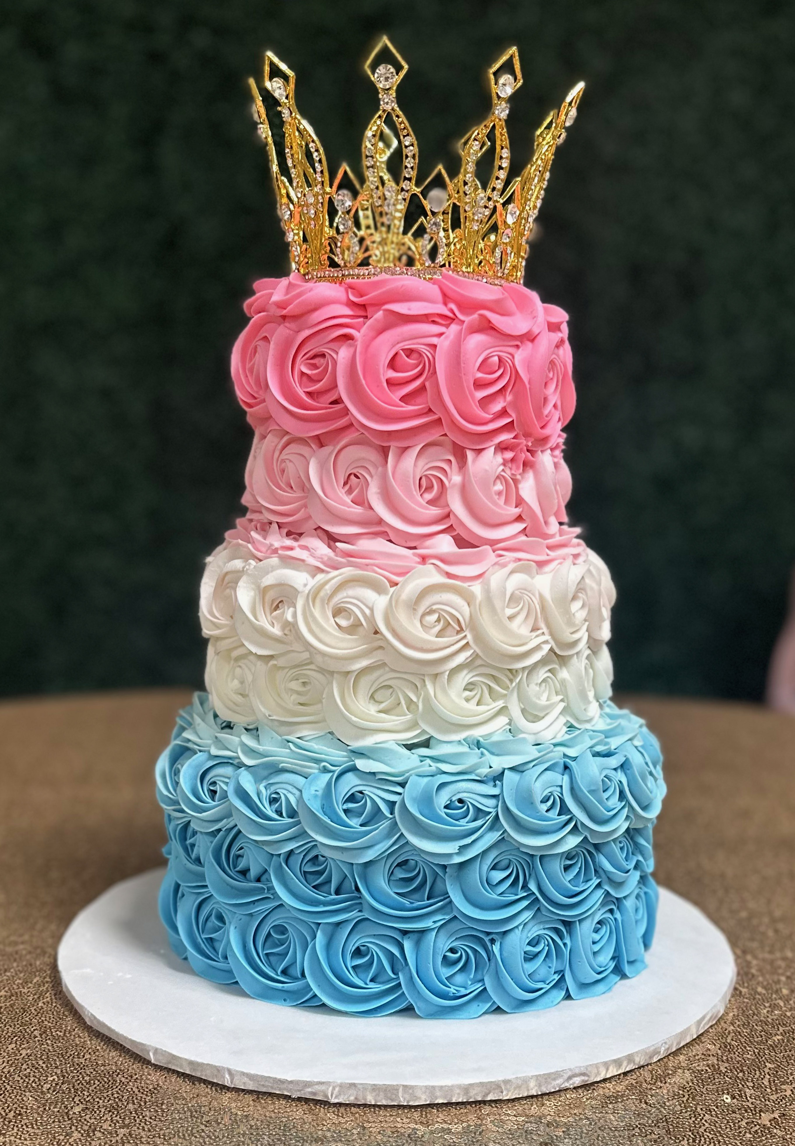 Flower Design Of Cake With Crown On Top